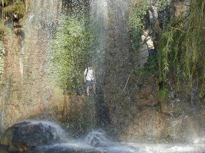 Photo: Gerald behind a waterfall