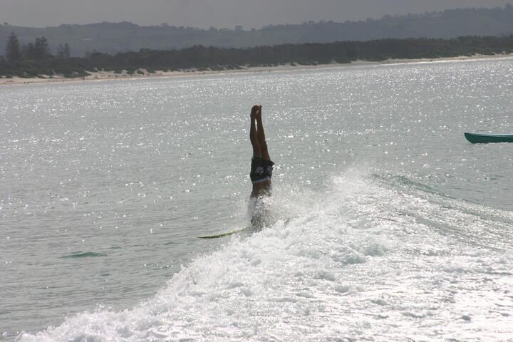 Surfer doing headstand