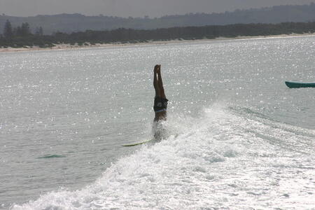 Photo: Surfer doing headstand