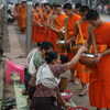 Previous: Monks collecting alms