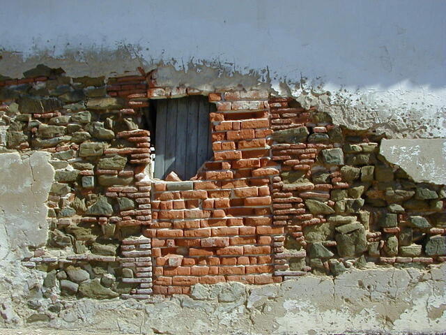 A decaying brick wall