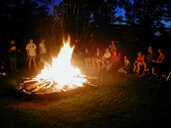 Friends around a campfire, Ontario, Canada, August 2000