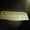 Next: Lafitte's Blacksmith Shop sign