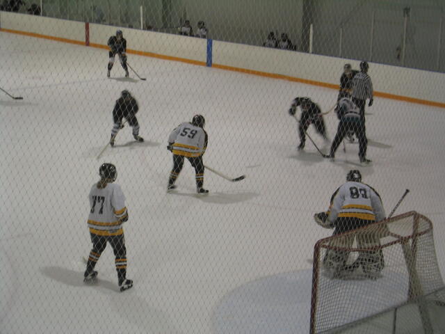 Alana playing hockey