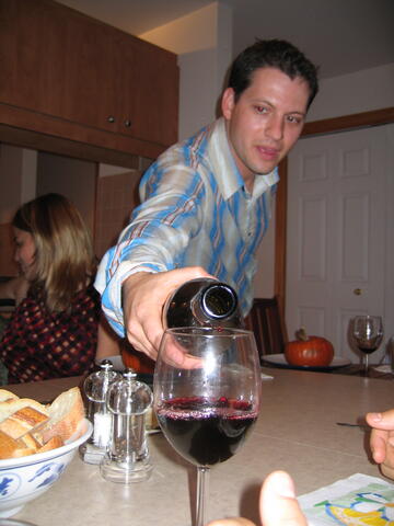 Roger pouring wine