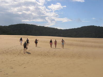 Photo: Walking across sand dunes