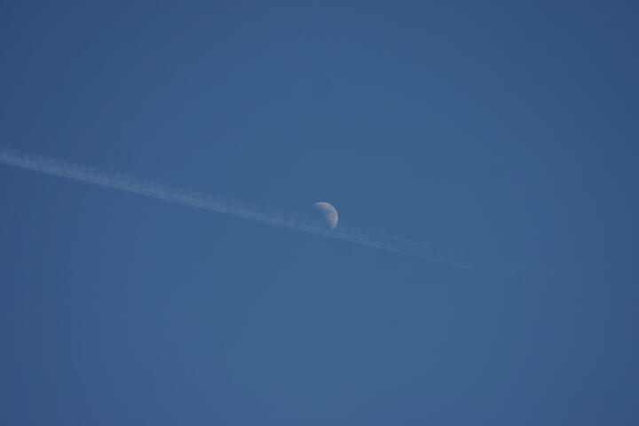 Moon and contrail