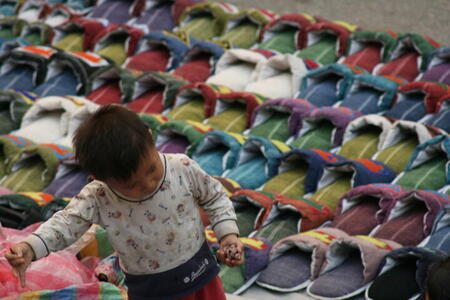 Photo: Boy and slippers