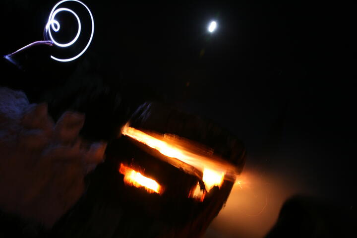 Headlamp, fire, moon
